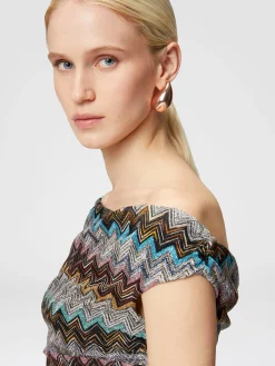 Abito lungo zig zag lamé con scollatura asimmetrica