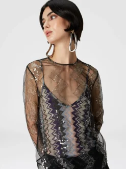 Blusa doppiata in tulle con paillettes