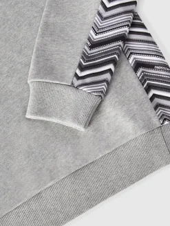 Felpa in cotone con cappuccio, inserti zig zag e logo