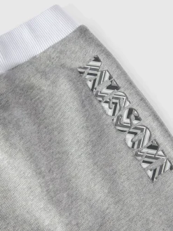 Joggers in cotone con stampa logo a rilievo