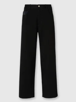 Pantaloni cargo in denim con inserti in maglia chevron