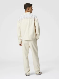 Pantaloni classici in denim con inserti in maglia chevron