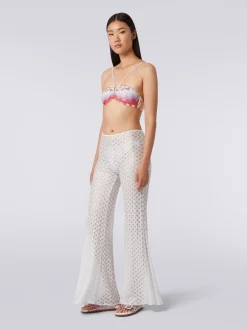 Pantaloni copricostume effetto pizzo con fondo svasato