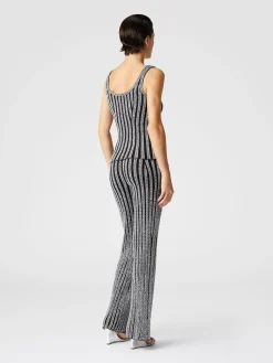 Pantaloni flare a costine zig zag con paillettes