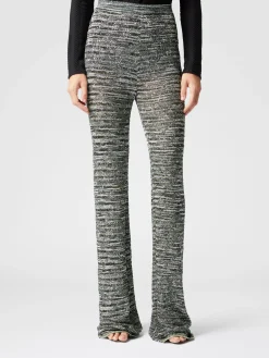 Pantaloni flare in maglia fiammata con paillettes