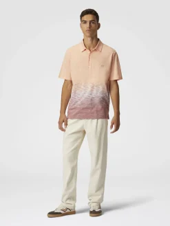 Polo in cotone e lino fiammato con ricamo zig zag