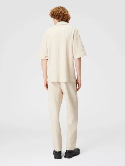 Polo in maglia boxy fit con chevron tono su tono