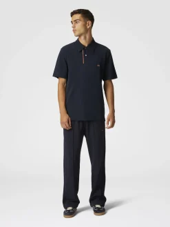 Polo in piquet di cotone tinta unita con ricamo zig zag e dettaglio a contrasto
