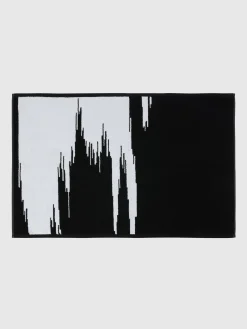 Tappetino da bagno Skunk 60x90 cm in cotone fiammato
